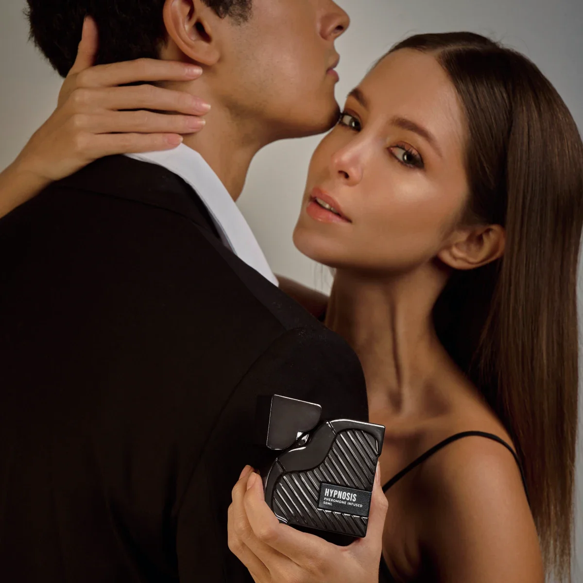 Couple embracing with Hypnosis pheromone fragrance